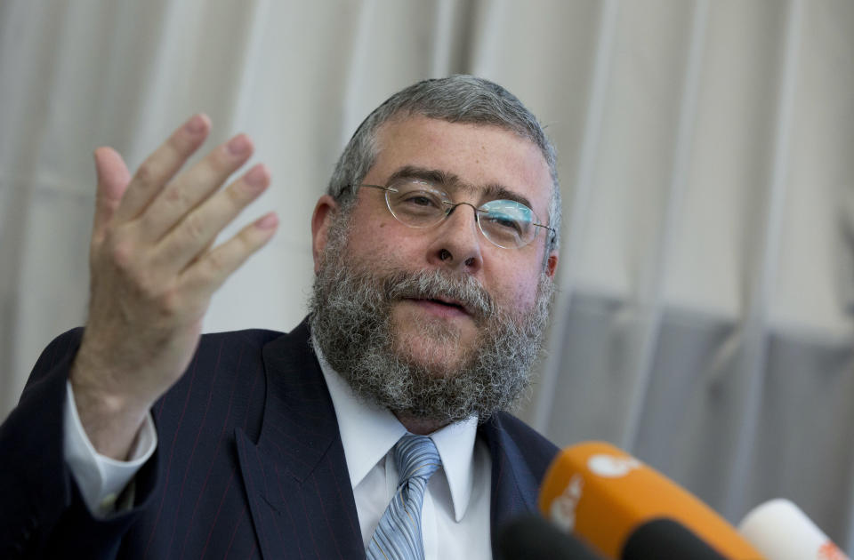 FILE - In this July 12, 2012 file photo, Rabbi Pinchas Goldschmidt, cheif of the Conference of European Rabbis, gestures during a news conference in Berlin, Germany, Thursday, July 12, 2012. Chief Rabbi Goldschmidt will give the Moshe Rosen Award, which recognizes non-Jews who promote dialogue, understanding and tolerance to ensure a Jewish future in Europe, to founder of Catholic charity Andrea Riccardi during a ceremony Thursday, Oct. 24, 2019 in Rome. (AP Photo/Gero Breloer, file)