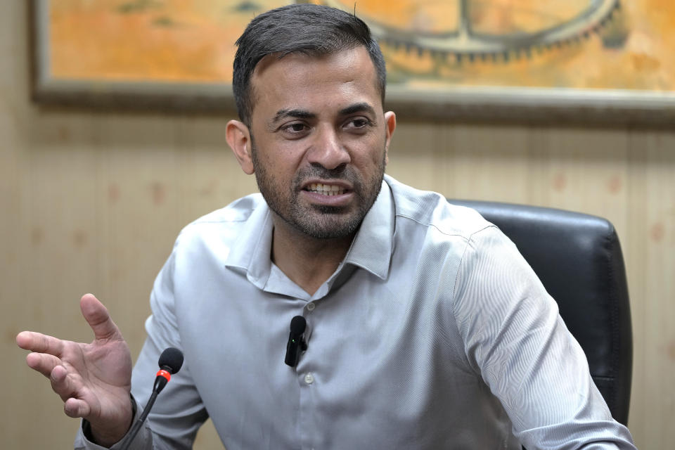 Pakistan fast bowler Wahab Riaz speaks during a press conference, in Lahore, Pakistan, Wednesday, Aug. 16, 2023. Riaz retired from international cricket on Wednesday but will continue to play franchise cricket. (AP Photo/K.M. Chaudary)