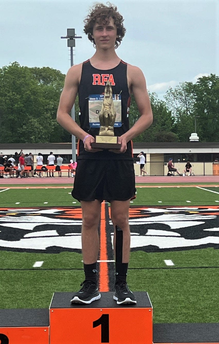 Rome Free Academy's William D'Agata takes his spot atop the awards stand after winning the pole vault at the 55th annual Glenn D. Loucks Games in White Plains.