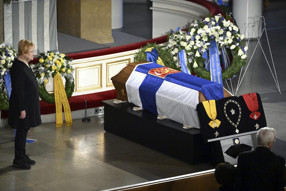 Former president Tarja Halonen pays respect by the coffin of former President of the Republic Martti Ahtisaari during the state funeral at the Helsinki Cathedral in Helsinki, Finland, Friday, Nov. 10, 2023. Foreign dignitaries gathered in Finland’s capital on Friday to bid farewell to former President Martti Ahtisaari, including leaders of countries where he helped reach peace accords. Ahtisaari, who was awarded the Nobel Peace Prize in 2008, died Oct. 16 at the age of 86. (Heikki Saukkomaa/Lehtikuva via AP)