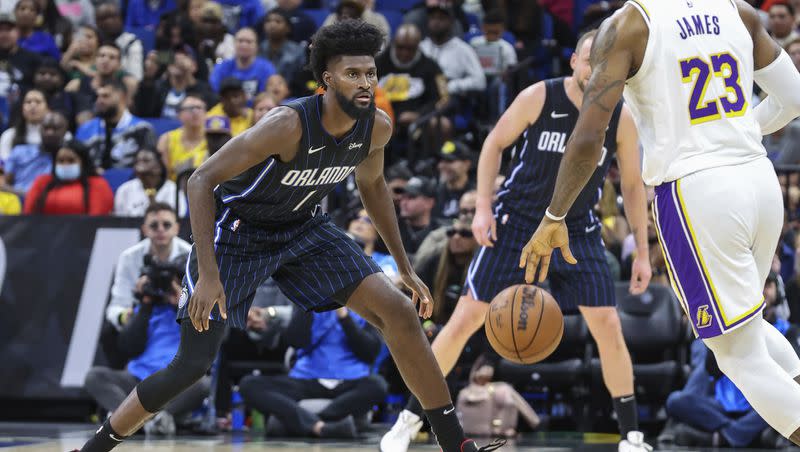 Orlando Magic forward Jonathan Isaac (1) defends against Los Angeles Lakers forward LeBron James (23) during the second half of an NBA basketball game, Saturday, Nov. 4, 2023, in Orlando, Fla.