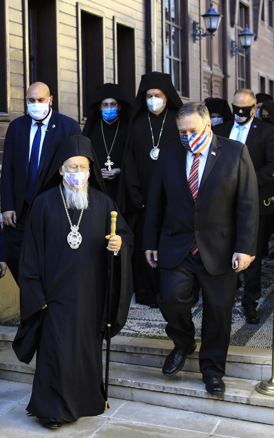 Ecumenical Patriarch Bartholomew I, left, the spiritual leader of the world's Orthodox Christians, walks with US Secretary of State Mike Pompeo, following their meeting in Istanbul, Tuesday, Nov. 17, 2020. Pompeo is visiting Turkey as part of a seven-nation trip to Europe and the Middle East. (Umit Bektas/Pool via AP)