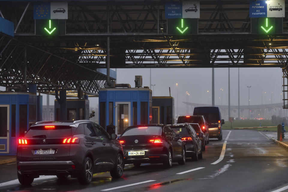 Passengers wait to cross the border between Croatia and Slovenia at the Bregana border crossing, Thursday, Dec. 8, 2022. European Union countries are weighing on Thursday whether the bloc’s three newest members — Bulgaria, Romania, and Croatia — can fully open their borders and participate in Europe’s ID-check-free travel zone, but more delays to their entry appear likely. (AP Photo)