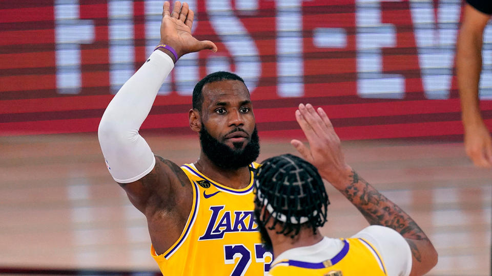 LeBron James and Anthony Davis are seen here about to high-five one another.