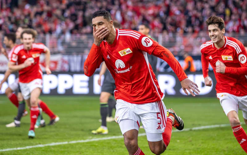 Union Berlin's Danilho Doekhi celebrates with his teammates after scoring his side's first goal of the game during the German Bundesliga soccer match between FC Union Berlin and VfL Wolfsburg at An der Alten Foersterei. Andreas Gora/dpa