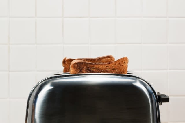 Two slices of toast in toaster