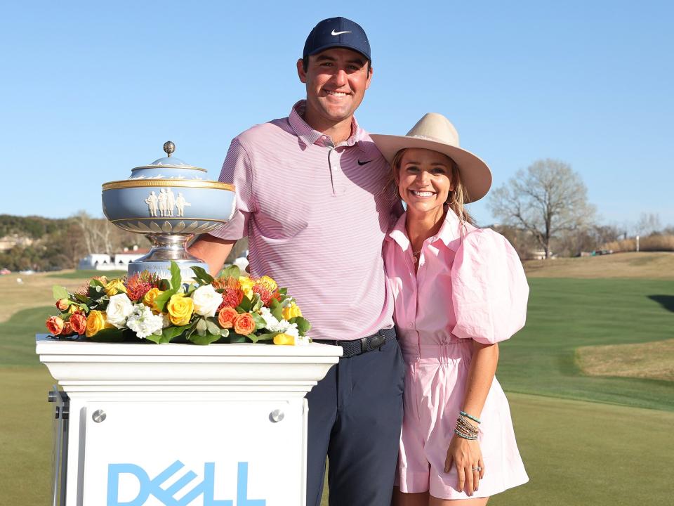 Scottie Scheffler of the United States poses with his wife Meredith Scheffler and the Walter Hagen Cup after defeating Kevin Kisner of the United States 4&3 in thier finals match to win the World Golf Championships-Dell Technologies Match Play at Austin Country Club on March 27, 2022 in Austin, Texas
