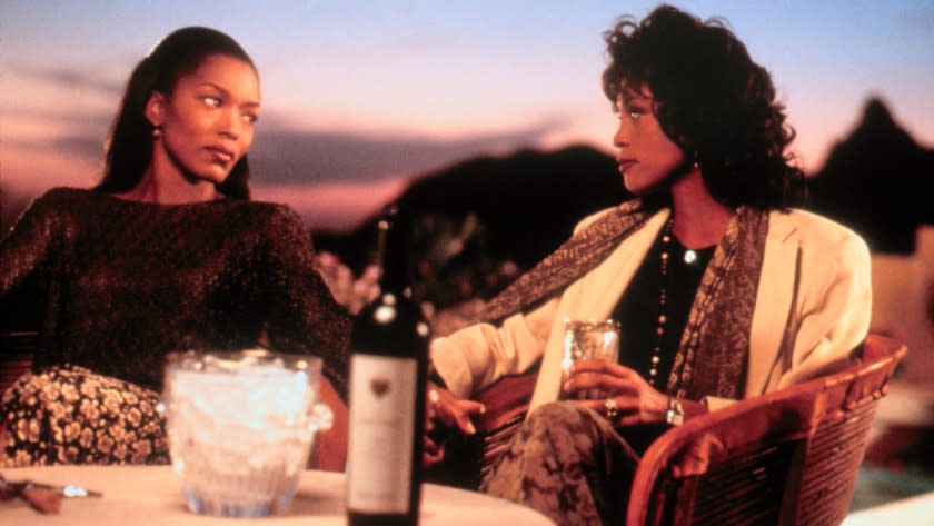 Angela Bassett and Whitney Houston looking at each other in "Waiting to Exhale"