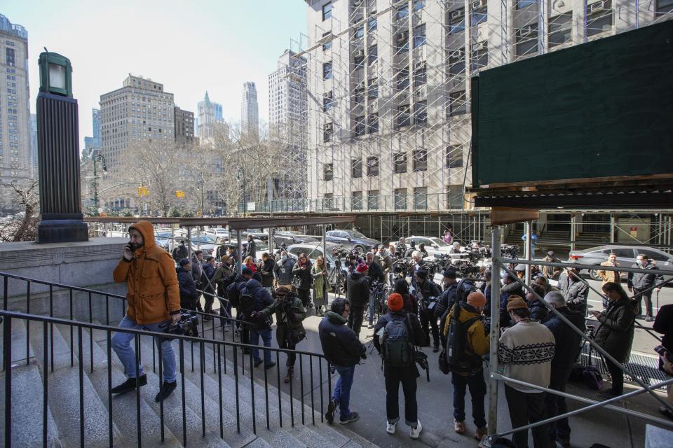 Members of the media set up cameras in front of the courthouse ahead of former President Donald Trump's anticipated indictment on Monday, March 20, 2023, in New York. (AP Photo/Eduardo Munoz Alvarez)