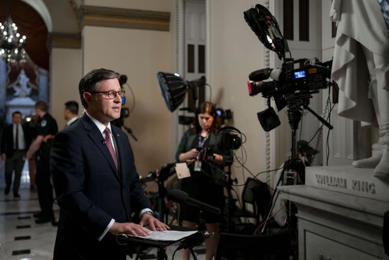 Speaker of the House Mike Johnson, R-La., speaks to Jake Tapper on CNN outside the House Chambers on Wednesday. Johnson says he plans to advance an aid package for Ukraine, Israel and Taiwan later this week, despite opposition from Freedom Caucus members. Photo by Bonnie Cash/UPI