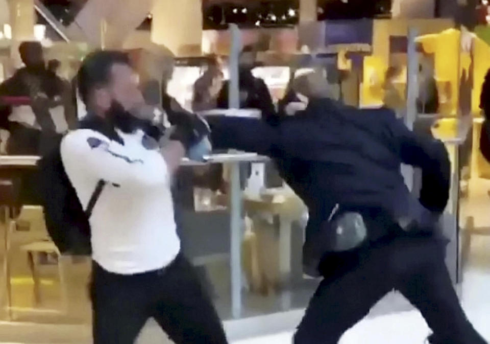 This is the shocking moment a security guard and a shopper viciously brawled outside a Selfridges following a row about entering the store with rollerblades. The smartly-dressed security worker traded punches with the irate customer after violence erupted at Birmingham's Bull Ring shopping centre on Saturday (26/9). The pair can be seen adopting boxing stances before exchanging blows in front of stunned shoppers at the entrance of the posh department store. In the footage, obtained by website Birmz Is Grime, one man can be heard saying "chill man" before the video ends with two burly men continuing to swing punches.