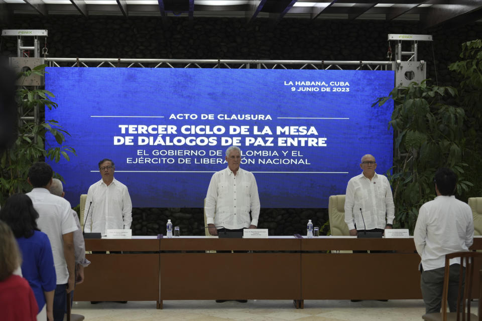 Cuban President Miguel Diaz-Canel stands between Colombia's President Gustavo Petro, left, and ELN commander Antonio Garcia, during a bilateral ceasefire agreement signing ceremony between the Colombian National Liberation Army (ELN) guerrilla and the Colombian government, at El Laguito in Havana, Cuba, Friday, June 9, 2023. (AP Photo/Ramon Espinosa)