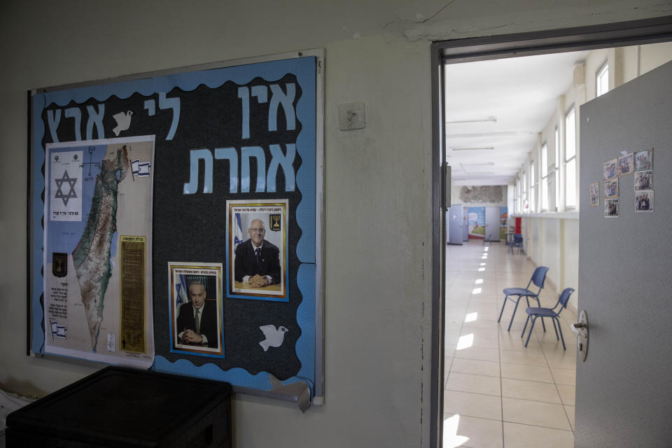 A closed primary school is seen in Ramat Gan, Israel, Sunday, March 15, 2020. Israel has imposed a number of tough restrictions to slow the spread of the new coronavirus. Netanyahu announced that schools, universities, restaurants and places of entertainment will be closed to stop the spread of the coronavirus. He also encouraged people not to go to their workplaces unless absolutely necessary. For most people, the new coronavirus causes only mild or moderate symptoms. For some it can cause more severe illness. (AP Photo/Oded Balilty)