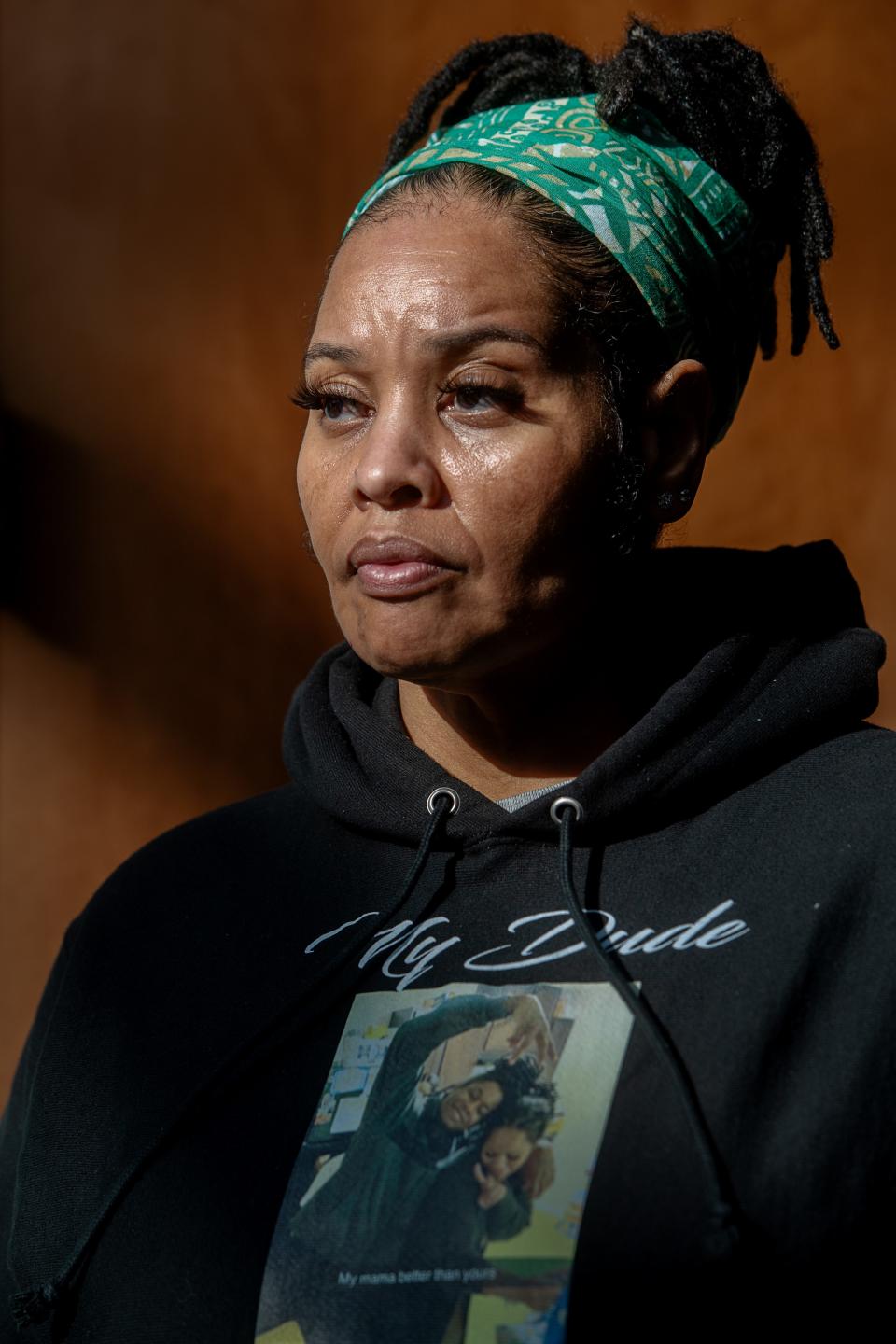 Patricia King wears a sweatshirt with a picture of her and her son, Elijah Timmons III, at the Henderson County Courthouse, March 4, 2024.