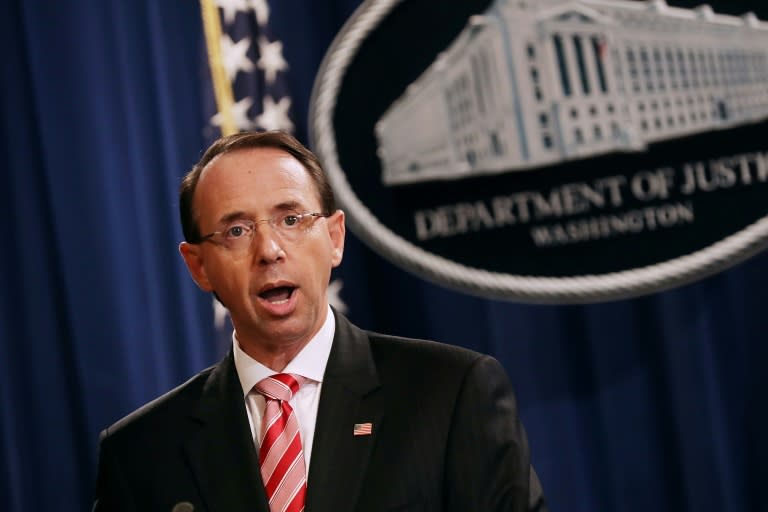 US Deputy Attorney General Rod Rosenstein told reporters 12 Russian military officers were accused of "conspiring to interfere with the 2016 presidential election"