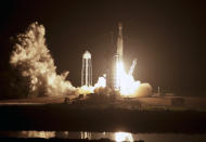 A SpaceX Falcon heavy rocket lifts off from pad 39A at the Kennedy Space Center in Cape Canaveral, Fla., early Tuesday, June 25, 2019. The Falcon rocket has a payload military and scientific research satellites. (AP Photo/John Raoux)