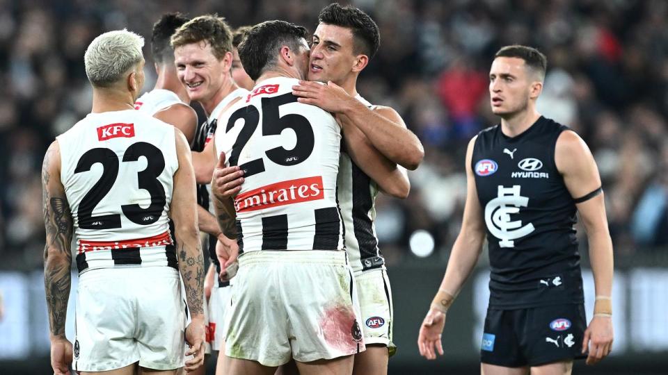 Happy Collingwood players.