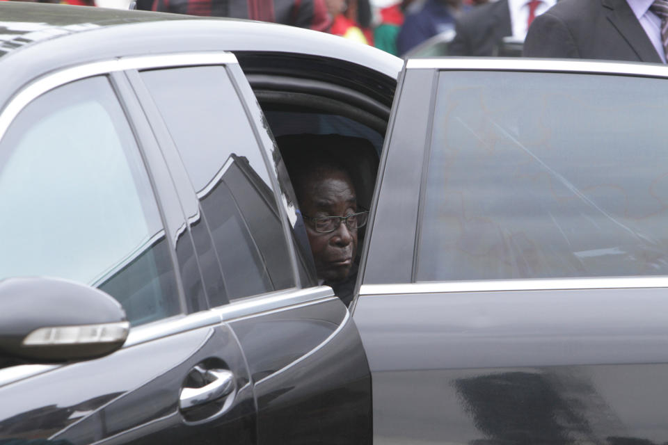 Zimbabwe's President Robert Mugabe arrives for celebrations to mark his 90th birthday in Marondera, east of Harare, Sunday, Feb. 23, 2014. In July, Mugabe who has ruled the nation for 33 years since 1980, won disputed elections for another five-year term that will take him to age 94. (AP Photo/Tsvangirayi Mukwazhi)