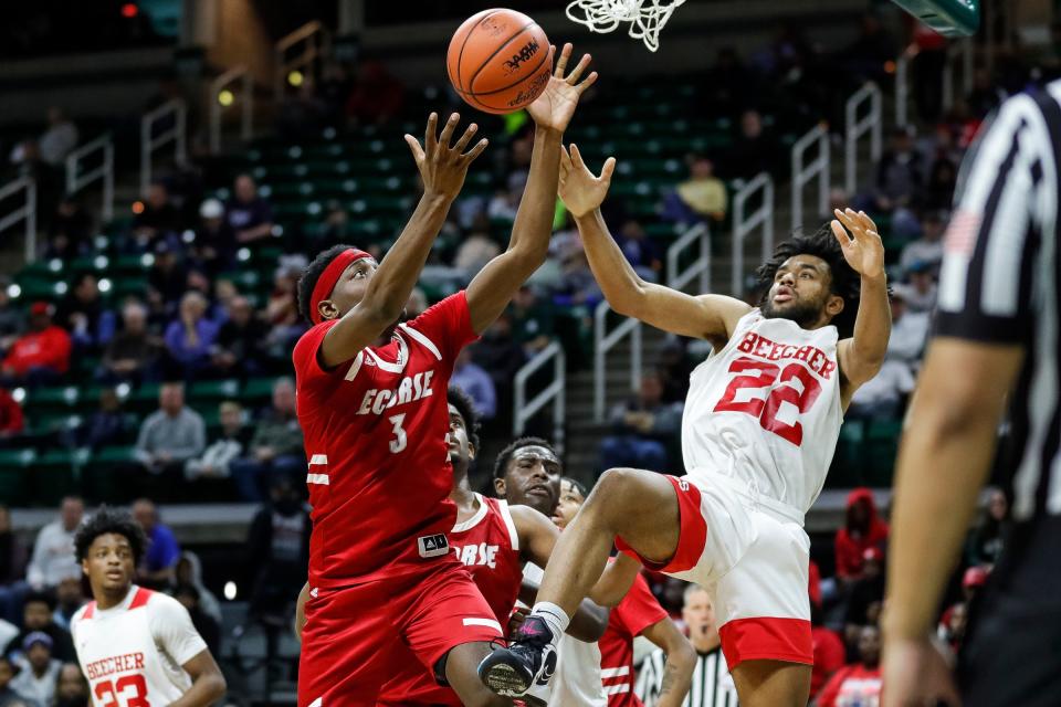 Ecorse guard Malik Olafioye and Flint Beecher forward Robert Lee Jr. battle for the rebound during the second half of Beecher's 64-53 win in the Division 3 semifinal at Breslin Center on Thursday, March 23, 2023.