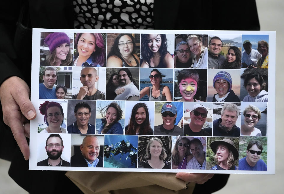 FILE - A photo collage of the 34 victims of the Sept. 2, 2019 fire aboard the dive boat, Conception, at Santa Cruz Island, is held by a family member arriving at federal court in Los Angeles, Wednesday, Oct. 25, 2023. A federal jury on Monday, Nov. 6, found scuba dive boat captain Jerry Boylan was criminally negligent in the deaths of 34 people killed in a fire aboard the vessel in 2019, the deadliest maritime disaster in recent U.S. history. (AP Photo/Damian Dovarganes,File)