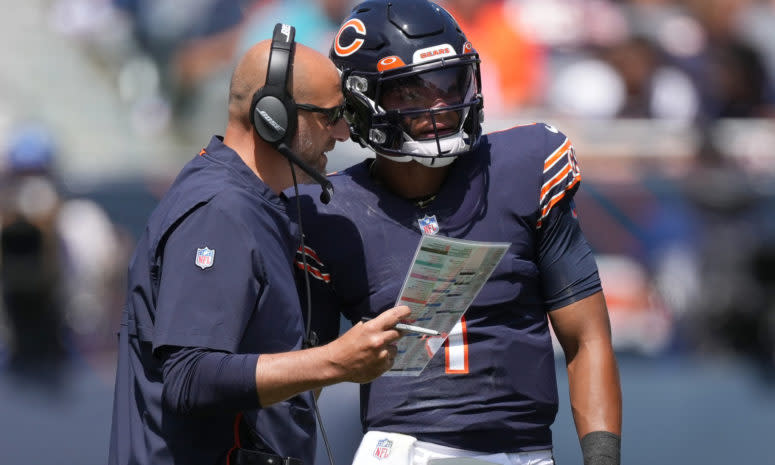 Bears head coach Matt Nagy stands alongside Justin Fields.