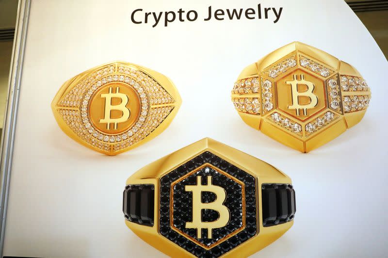 FILE PHOTO: An advertisement for Crypto Jewelry is seen displayed on the floor of the Consensus 2018 blockchain technology conference in New York City