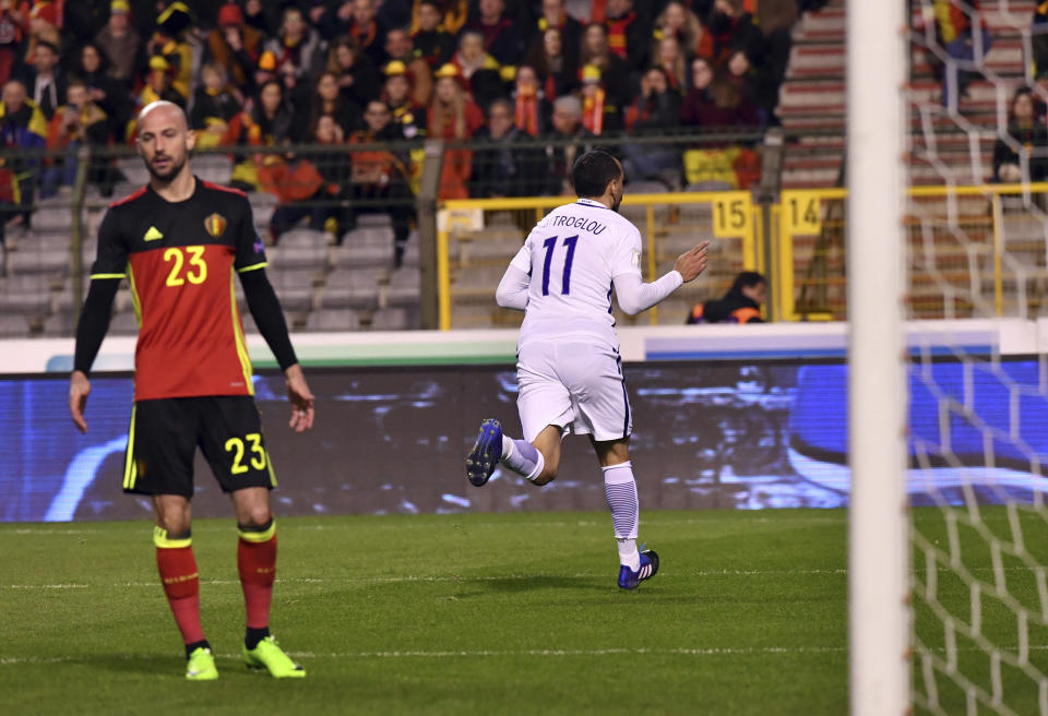 Greece's Kostas Mitroglou, right, runs past the goal after scoring the match's first goal during the Euro 2018 Group H qualifying match between Belgium and Greece at the King Baudouin stadium in Brussels on Saturday, March 25, 2017. (AP Photo/Geert Vanden Wijngaert)