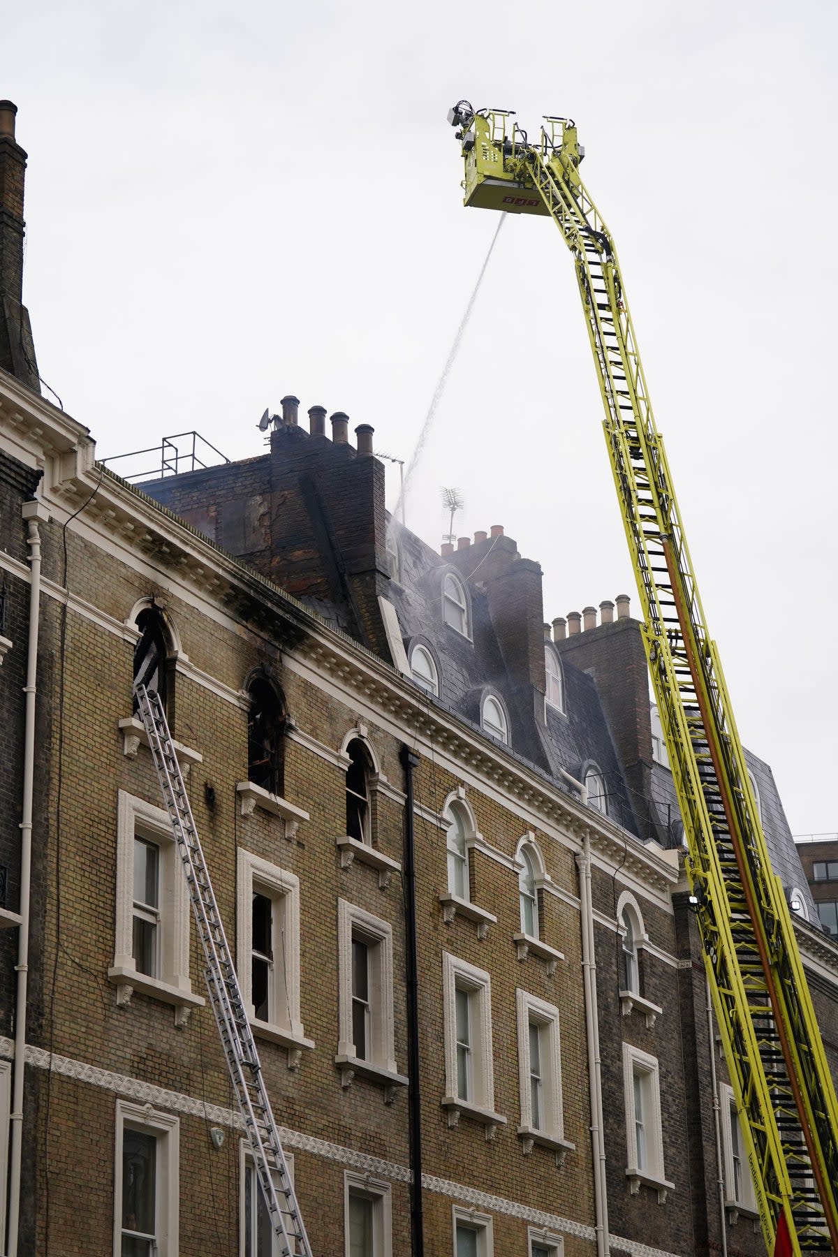 Firefighters at the scene on Friday morning (James Manning/PA Wire)