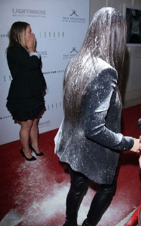 Kim Kardashian gets hit with a flour bomb at her fragrance launch