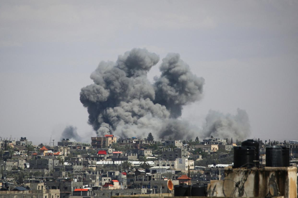 Smoke billows above Rafah as Israel claims to be targeting Hamas militants hiding in the city (AFP/Getty)