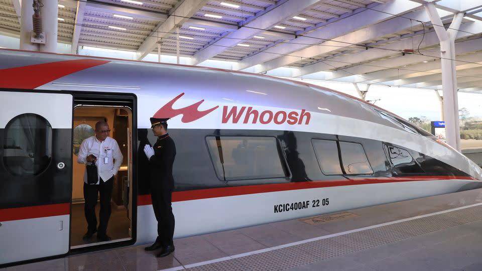 A passenger gets off a Chinese-funded high-speed train after its commercial operations launched last month in Indonesia. - Li Zhiquan/China News Service/VCG/Reuters