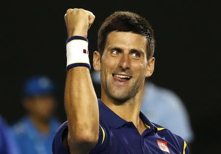 Serbia's Novak Djokovic celebrates after winning his semi-final match against Switzerland's Roger Federer at the Australian Open tennis tournament at Melbourne Park, Australia, January 28, 2016. REUTERS/Issei Kato