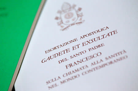 A Pope Francis document, known as an apostolic exhortation, entitled Gaudete et exsultate (Rejoice and be glad), is seen in this picture illustration taken at the Vatican, April 9, 2018. REUTERS/Alessandro Bianchi/Illustration