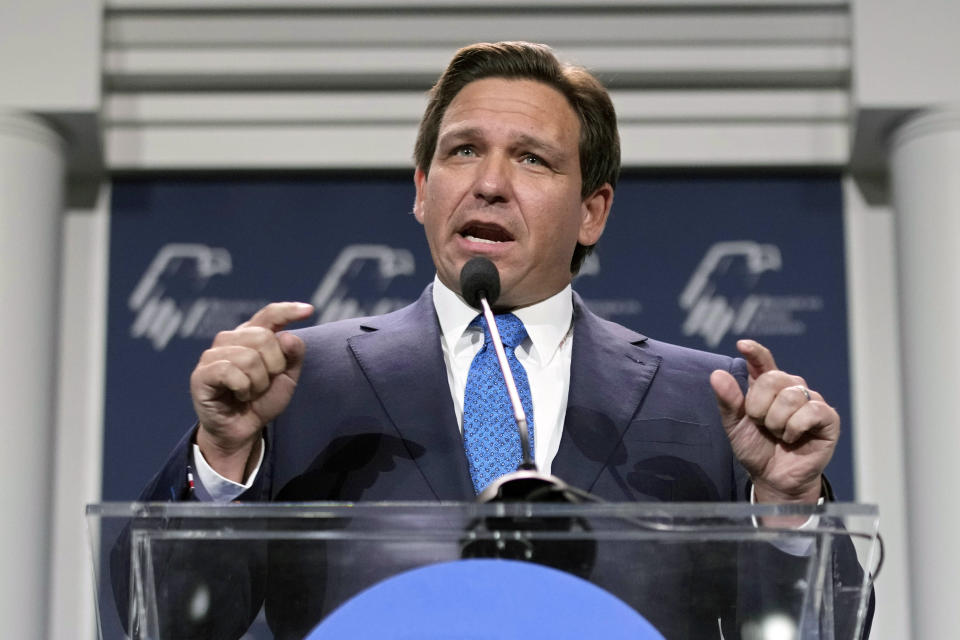 Florida Gov. Ron DeSantis speaking from a podium.