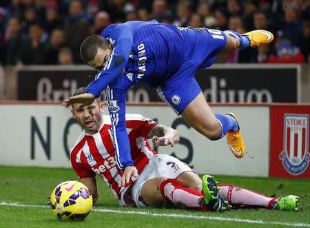 Stoke City's Phillip Bardsley challenges Chelsea's Eden Hazard (top) during their English Premier League soccer match at the Britannia Stadium in Stoke-on-Trent, northern England December 22, 2014. REUTERS/Darren Staples