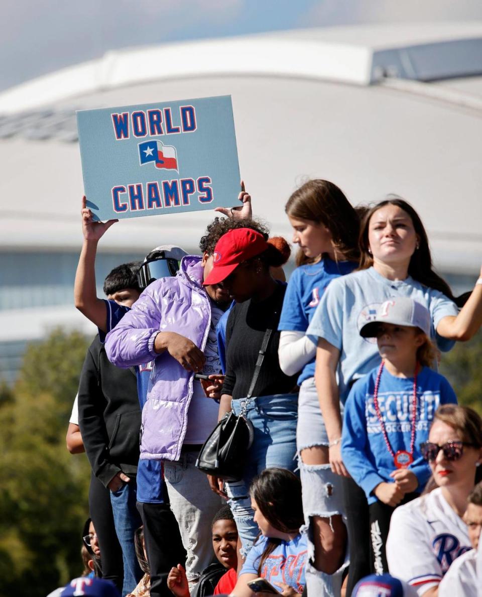 Fans cheer as players pass during the Texas Rangers World Series Parade in Arlington, Texas, Friday, Nov. 03, 2023. (Special to the Star-Telegram Bob Booth)