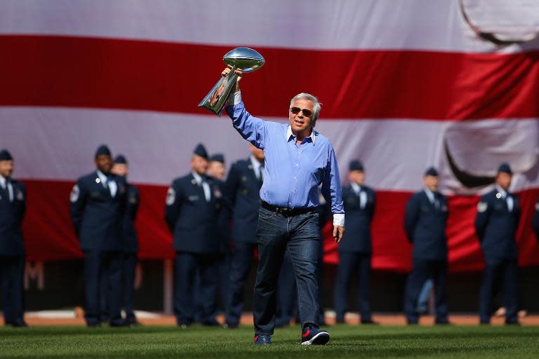 New England Patriots owner Robert Kraft enters Fenway Park holding the Vince Lombardi trophy before the game between the Washington Nationals and the Boston Red Sox on April 13, 2015 in Boston, Massachusetts