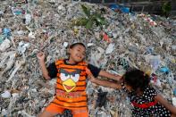 The Wider Image: Cash for trash: Indonesia village banks on waste recycling