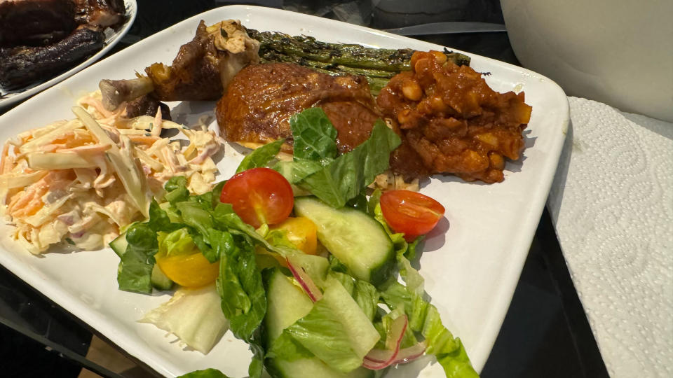 Plate with Wood smoked ribs, chicken, asparagus and beans