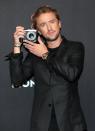 <p>Tom Felton snaps a photo during the Montblanc UltraBlack launch event at Feuerle Collection on Sept. 15 in Berlin.</p>