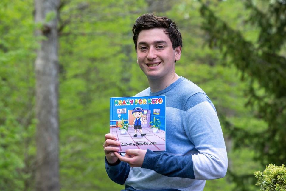 Brandon Kopp, 17, of Marlboro displays his children's book, Krazy for Keto, which he published in January about how he overcame severe epilepsy through diet in Marlboro, NJ Monday April 24, 2023. 