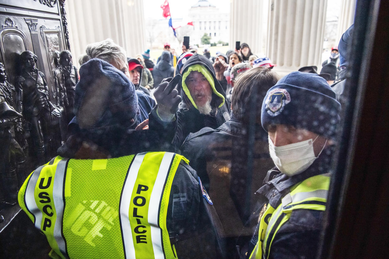 Rioters attempt to enter the Capitol (Tom Williams / CQ-Roll Call, Inc via Getty Images file)