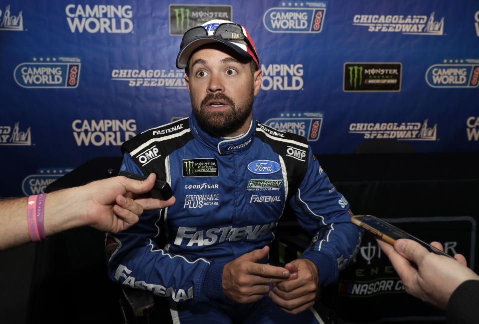 FILE - In this June 29, 2018, file photo, Ricky Stenhouse Jr., talks to media during a practice for the NASCAR Sprint Cup Series auto race at Chicagoland Speedway in Joliet, Ill. Ricky Stenhouse Jr. and Roush Fenway Racing will split at the end of the season and Chris Buescher will replace him in 2020. Although his contract is believed to run through 2021, the team said Wednesday, Sept. 25, 2019, it will part ways with the two-time Xfinity Series champion at the end of the year. (AP Photo/Nam Y. Huh, File)