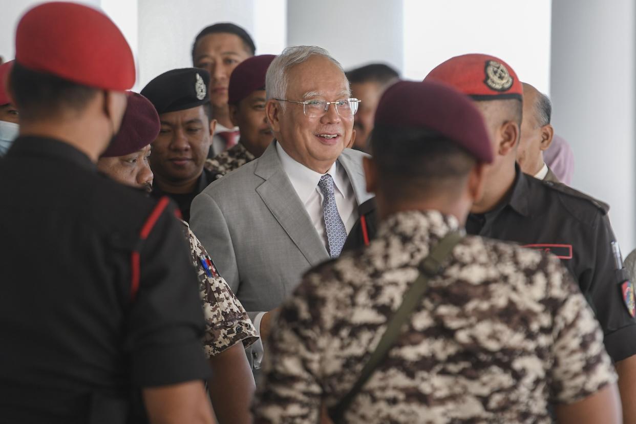 Former Malaysian Prime Minister Najib Razak walking outside the Kuala Lumpur High Court