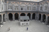The house of U.S. civil rights campaigner Rosa Parks, rebuilt by artist Ryan Mendoza, is on display in the courtyard of an 18th century Royal Palace, in Naples, Italy, Tuesday, Sept. 15, 2020. It’s the latest stop for the house in a years-long saga that began when Parks’ niece saved the tiny two-story home from demolition in Detroit after the 2008 financial crisis. (AP Photo/Gregorio Borgia)