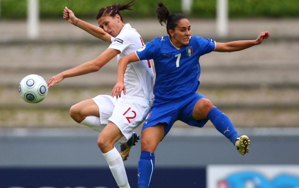 Jill Scott challenges Italy's Giulia Domenichetti in their 2009 group-stage match - GETTY IMAGES