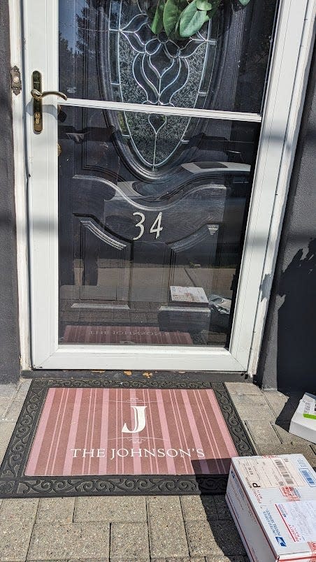Tai and Chris Johnson's front doormat welcomes you to 34 Rose Hill Terrace, in the 15th County Legislative District.