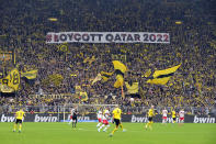 Fans display a banner during the German Bundesliga soccer match between Borussia Dortmund and VfB Stuttgart in Dortmund, Germany, Saturday, Oct. 22, 2022. (AP Photo/Martin Meissner)