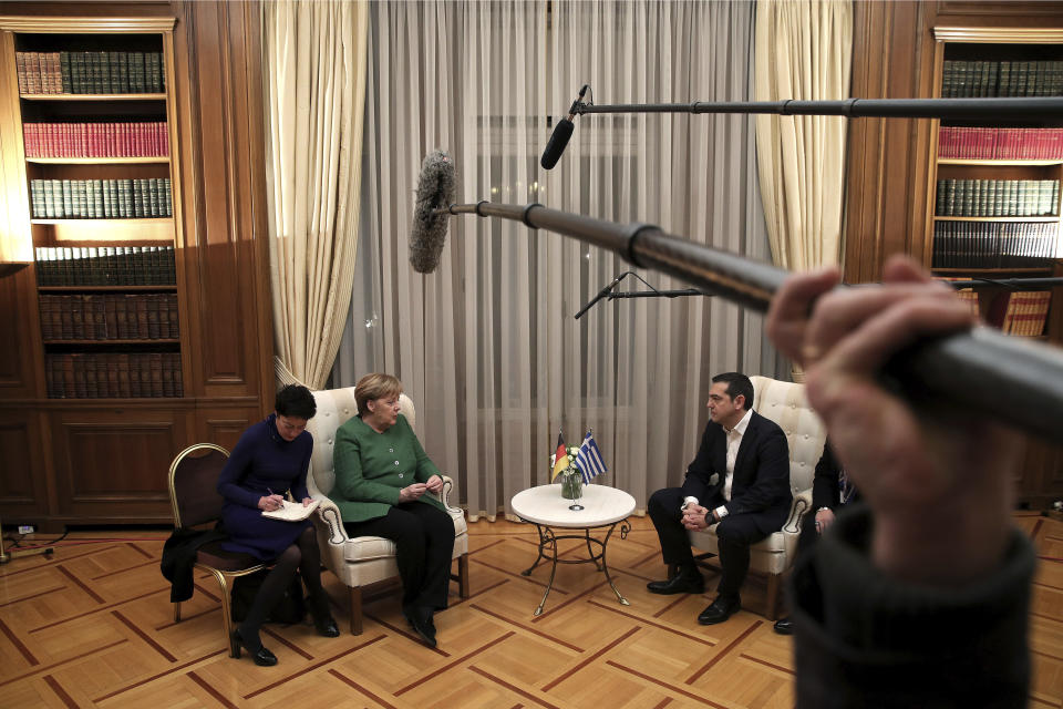 German Chancellor Angela Merkel, second left, talks with Greek Prime Minister Alexis Tsipras during their meeting in Athens, Thursday Jan. 10, 2019. Merkel is in Greece for talks. (AP Photo/Petros Giannakouris)