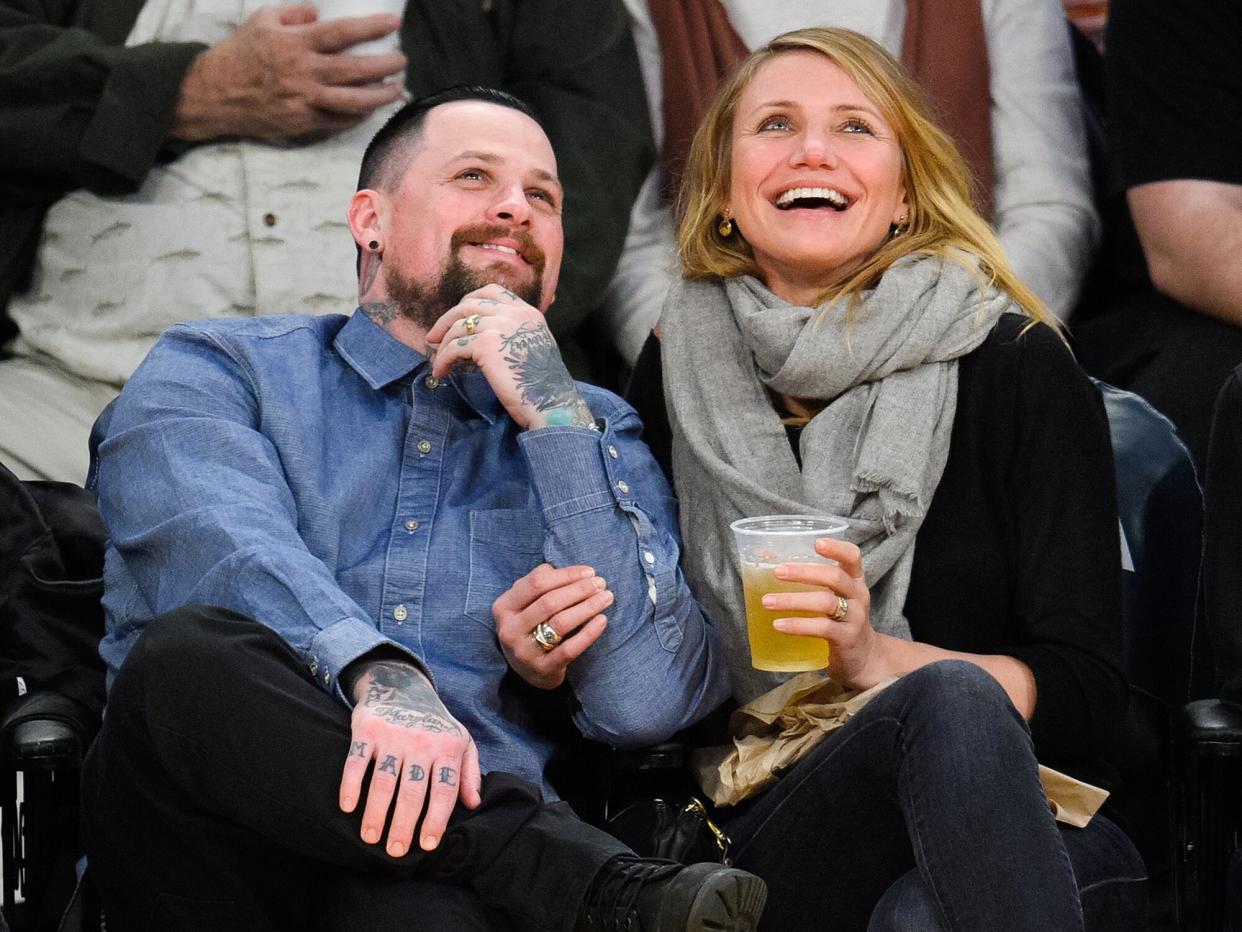 Benji Madden (L) and Cameron Diaz attend a basketball game between the Washington Wizards and the Los Angeles Lakers at Staples Center on January 27, 2015 in Los Angeles, California